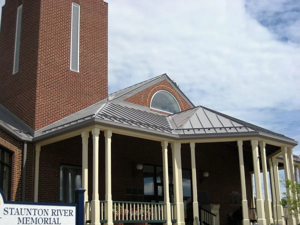 Skilled roofing craftsmen working on a residential roof in Asbury Park